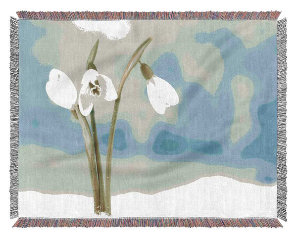 White snowdrops in the snow Woven Blanket