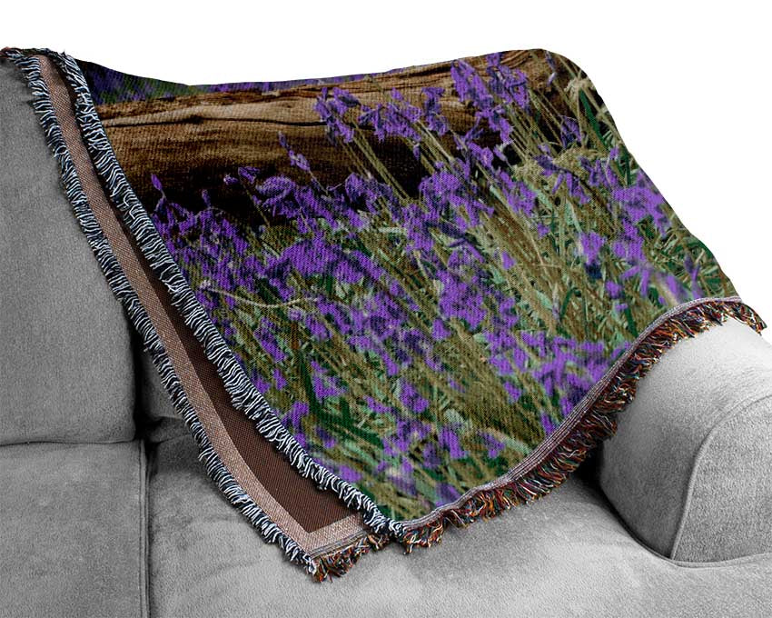 Purple flowers in the meadow Woven Blanket