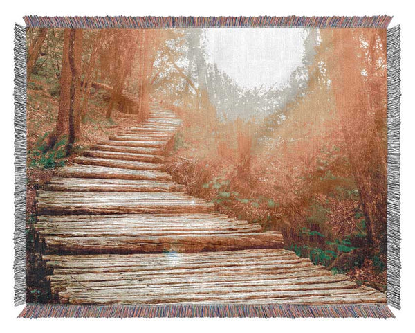 Log trail through the woods Woven Blanket