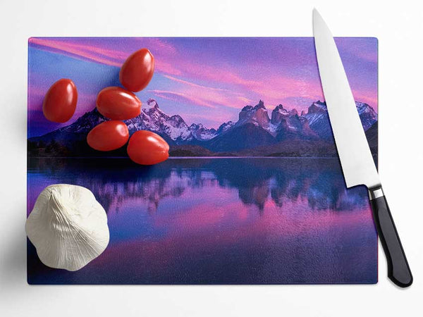 Purple and blue mountains above lake Glass Chopping Board