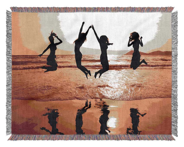 People jumping on the beach Woven Blanket