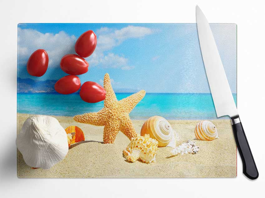Starfish standing in the sand Glass Chopping Board