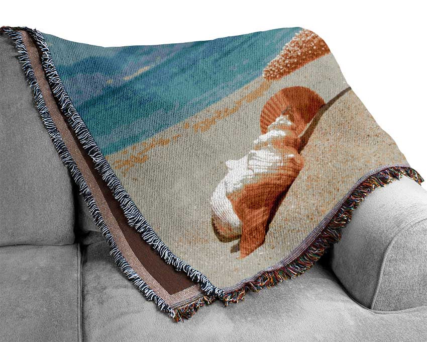 Starfish standing in the sand Woven Blanket