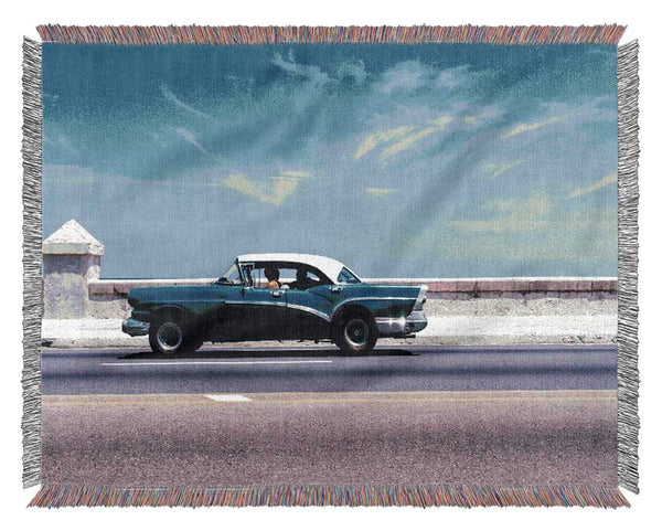 Classic car down the highway Woven Blanket