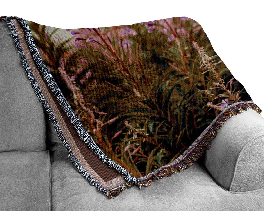 pink flowers in front of the stream Woven Blanket