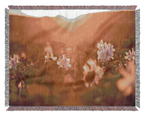 Diffused light on the meadow Woven Blanket