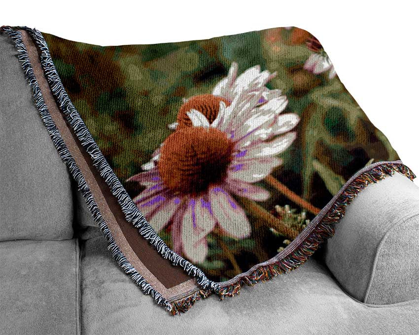 Pink flowers down below in the grass Woven Blanket