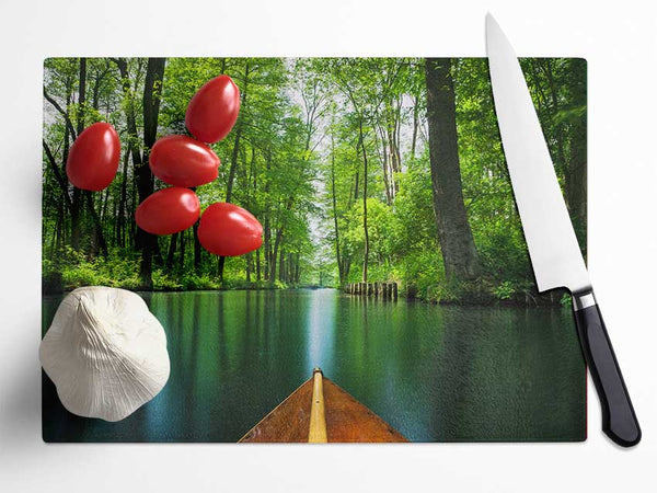 Sitting on a row boat journey Glass Chopping Board