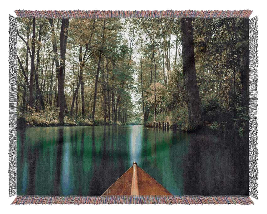 Sitting on a row boat journey Woven Blanket