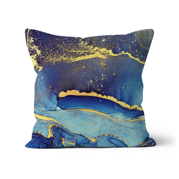 Abstraktes Kissen mit blauem und goldenem Glitzer